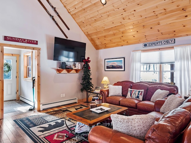 living room featuring baseboard heating, a healthy amount of sunlight, wood-type flooring, and wood ceiling