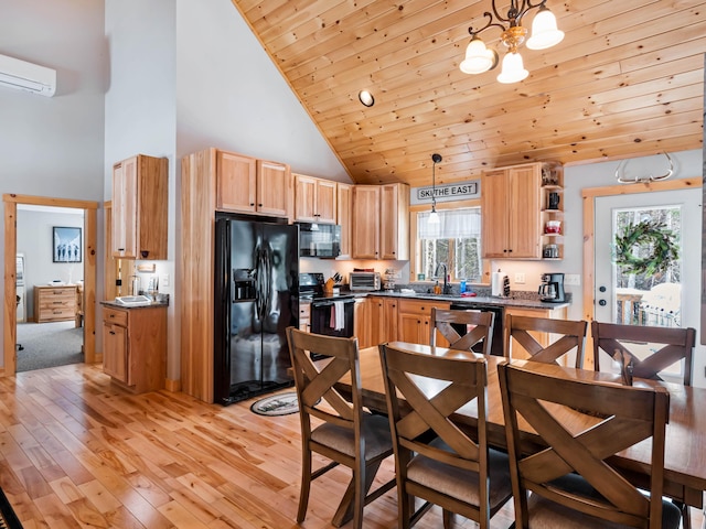 kitchen with sink, hanging light fixtures, black appliances, wooden ceiling, and light wood-type flooring