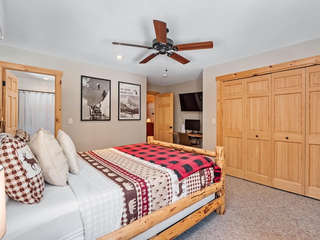 bedroom with ceiling fan, carpet flooring, and a closet