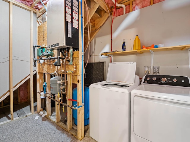 washroom featuring separate washer and dryer and water heater