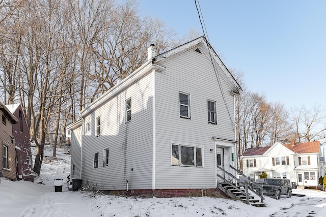 view of snow covered property