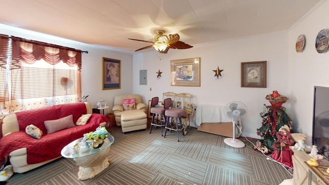 living room with crown molding, electric panel, ceiling fan, and carpet flooring