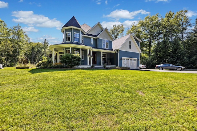 view of front of home with a porch, a garage, and a front lawn