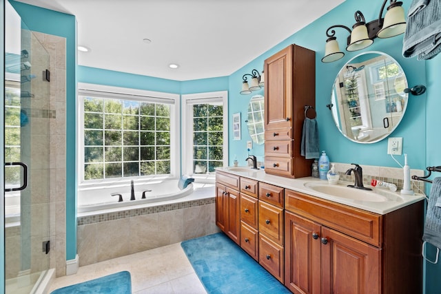 bathroom featuring tile patterned floors, plus walk in shower, and vanity