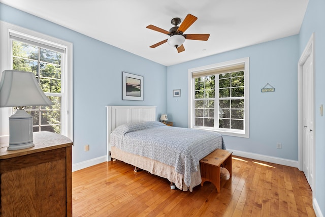 bedroom featuring light hardwood / wood-style floors and ceiling fan