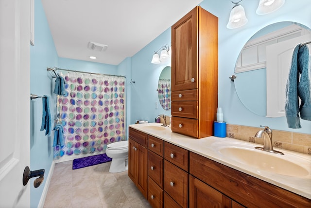 full bathroom with vanity, toilet, and shower / tub combo