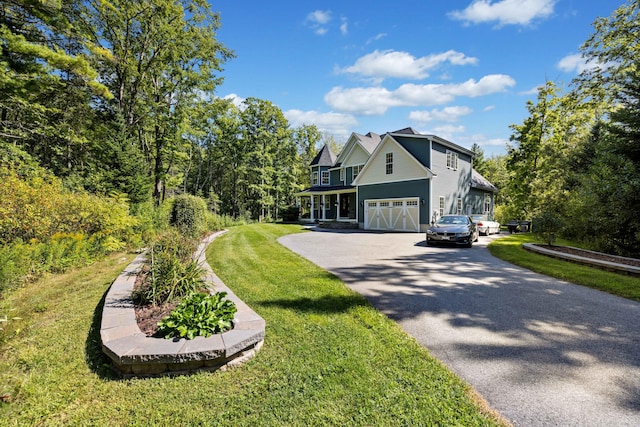 view of front facade with a garage and a front yard