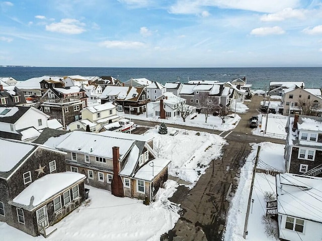 snowy aerial view featuring a residential view