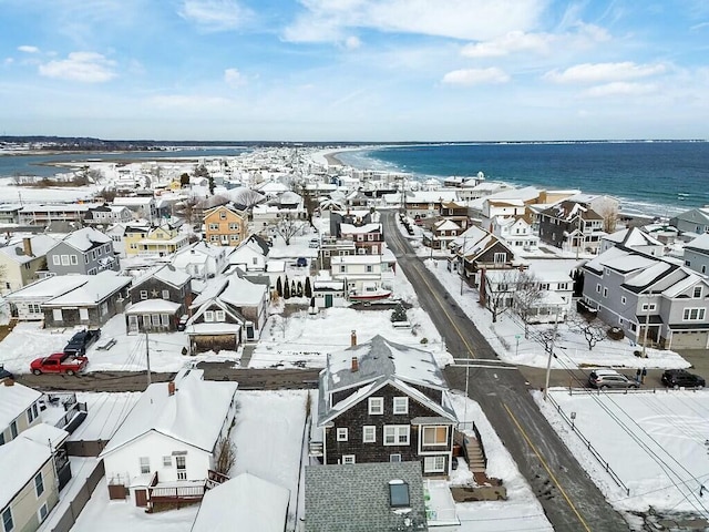 drone / aerial view featuring a water view and a residential view