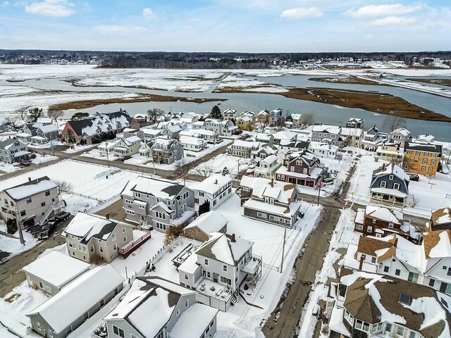 snowy aerial view featuring a residential view