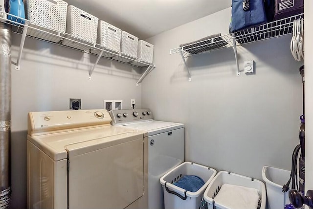 laundry room with laundry area and separate washer and dryer