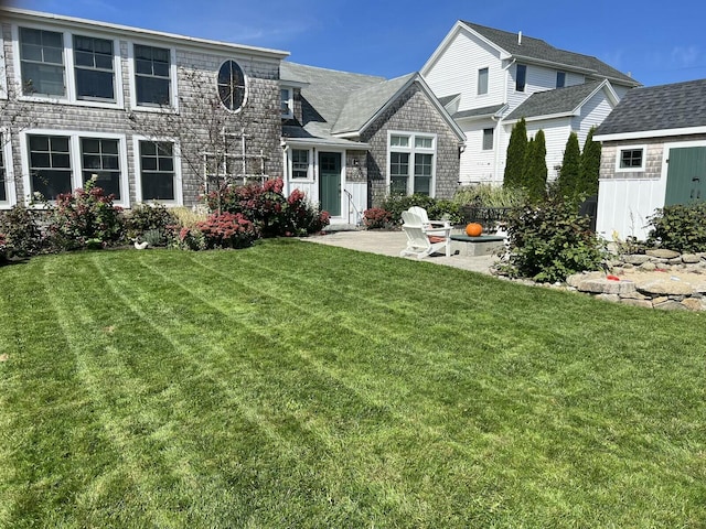 exterior space featuring a patio and a front lawn