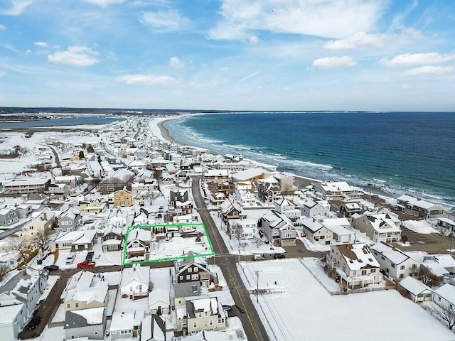 bird's eye view with a water view, a residential view, and a view of the beach