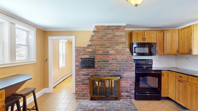 kitchen featuring light tile patterned flooring, black appliances, crown molding, and a baseboard radiator