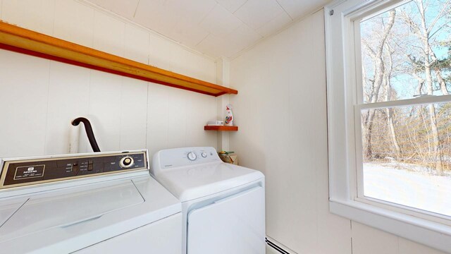 laundry area with laundry area, independent washer and dryer, and a wealth of natural light