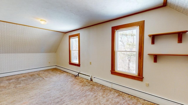 additional living space with vaulted ceiling, carpet, and baseboard heating