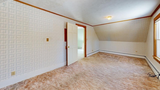 additional living space with wallpapered walls, lofted ceiling, carpet, and a baseboard radiator