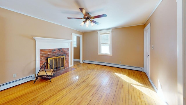 unfurnished living room with baseboard heating, a brick fireplace, crown molding, and wood-type flooring