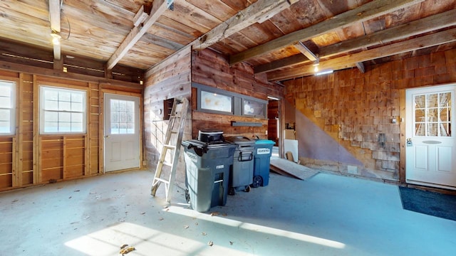 miscellaneous room with beam ceiling, wood ceiling, and wood walls