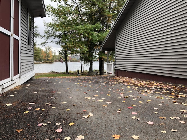 view of side of home featuring a water view