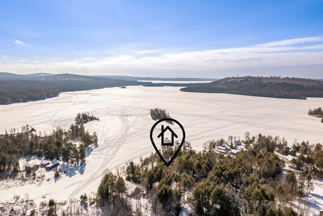 drone / aerial view featuring a water and mountain view