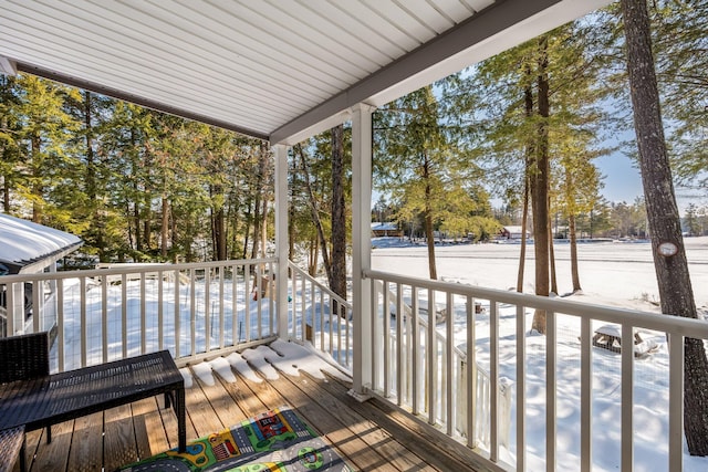 view of snow covered deck