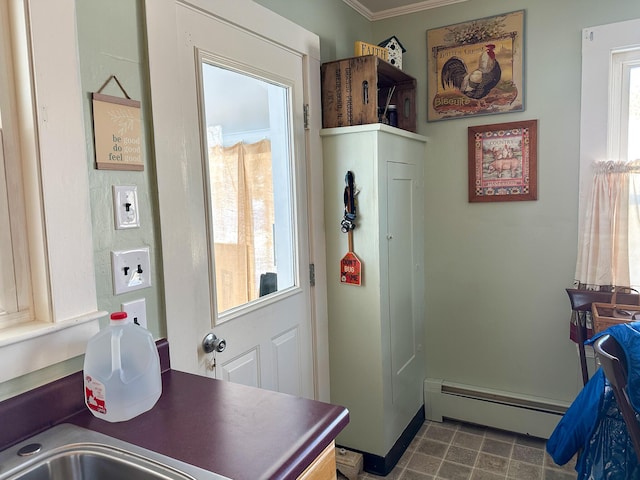 interior space with plenty of natural light and a baseboard heating unit