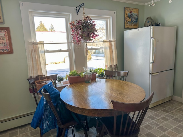 dining room with a baseboard heating unit