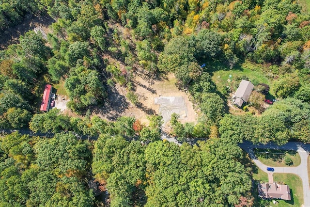 bird's eye view featuring a wooded view