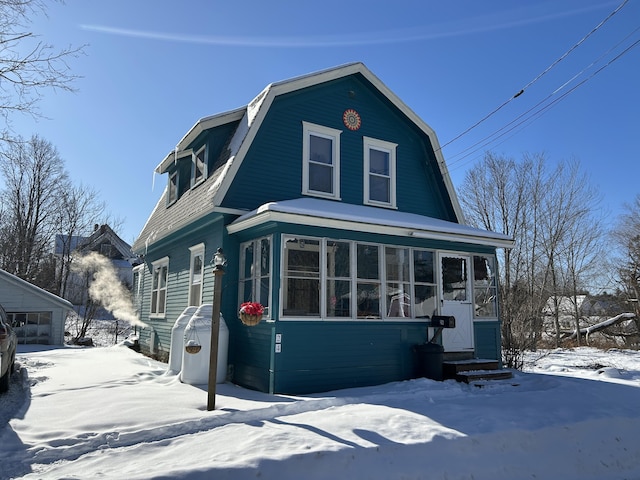 view of front of home featuring a sunroom