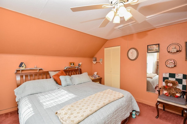 bedroom with vaulted ceiling, carpet floors, ceiling fan, and a closet