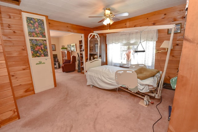 carpeted bedroom with wooden walls