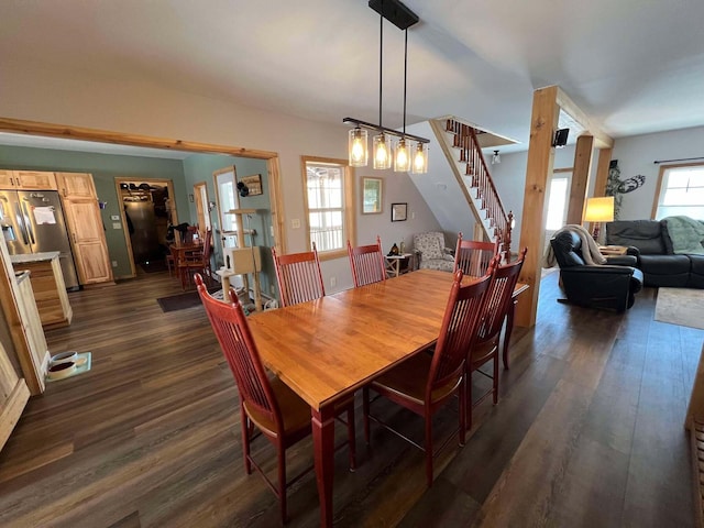 dining area featuring dark wood-type flooring