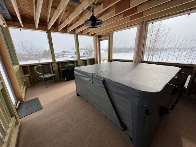 sunroom with a hot tub