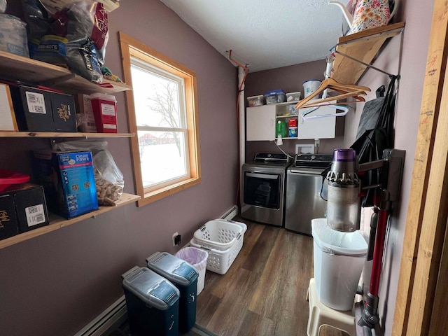 clothes washing area featuring dark hardwood / wood-style floors and washing machine and clothes dryer