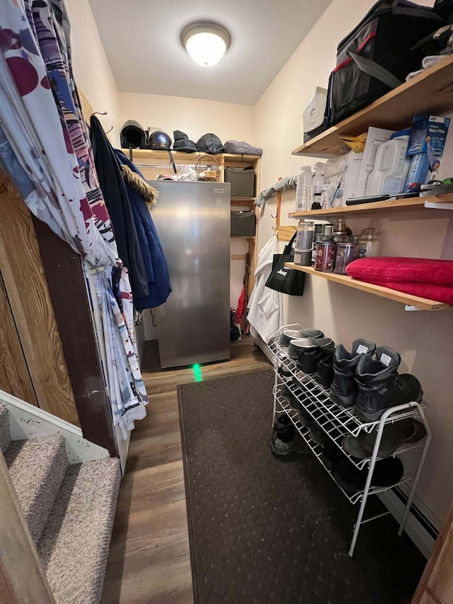 spacious closet with dark wood-type flooring