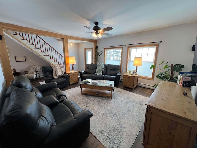 living room with hardwood / wood-style flooring, a baseboard radiator, and ceiling fan