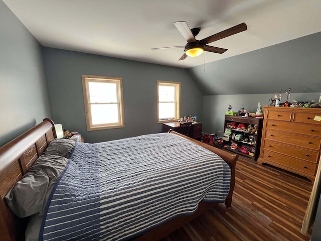 bedroom with lofted ceiling, dark hardwood / wood-style floors, and ceiling fan