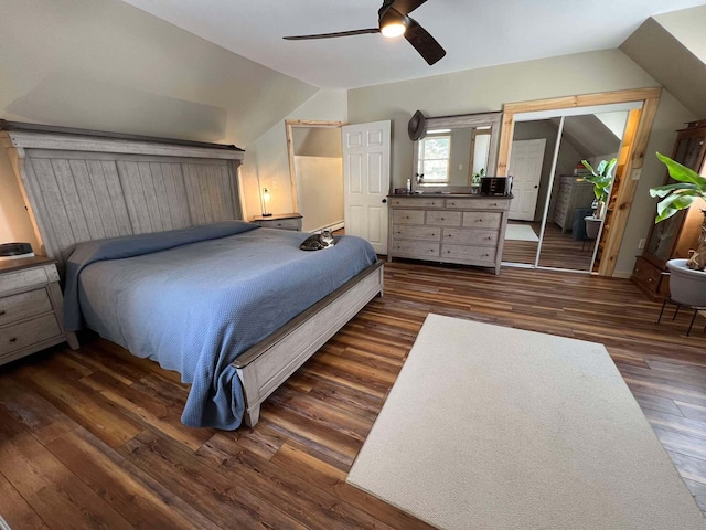 bedroom featuring lofted ceiling, dark hardwood / wood-style floors, and ceiling fan