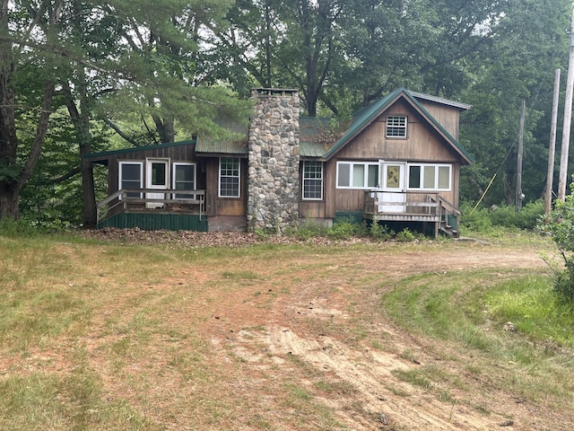 83 River Rd, Hiram, ME 04041 - back of house featuring a chimney and a deck