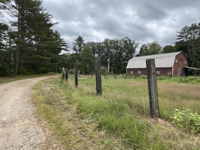 83 River Rd, Hiram, ME 04041 - view of dirt / gravel road featuring a barn