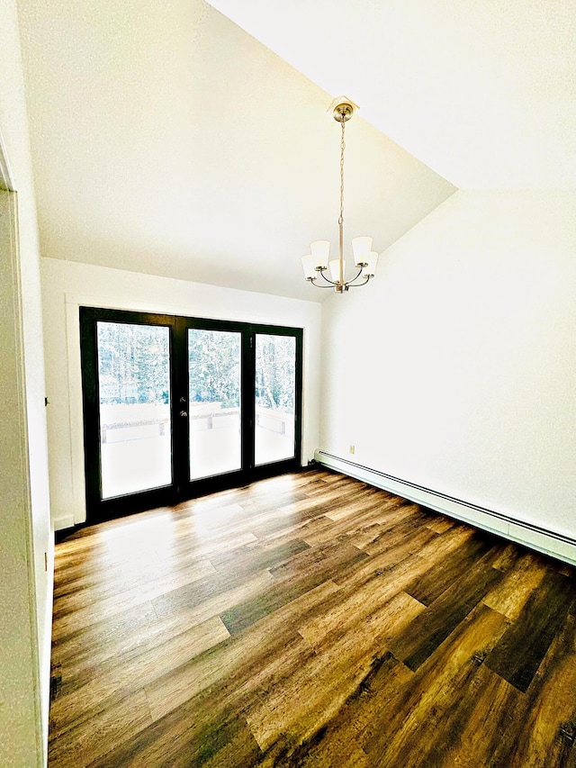unfurnished room featuring french doors, a chandelier, lofted ceiling, wood finished floors, and a baseboard radiator