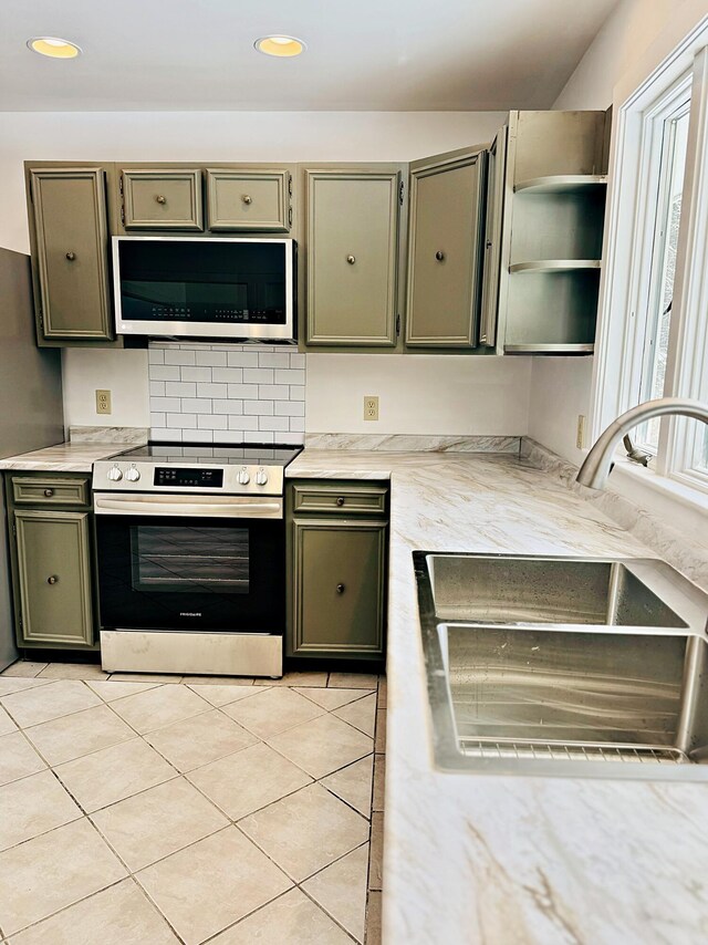 kitchen featuring recessed lighting, light countertops, open shelves, a sink, and stainless steel electric stove