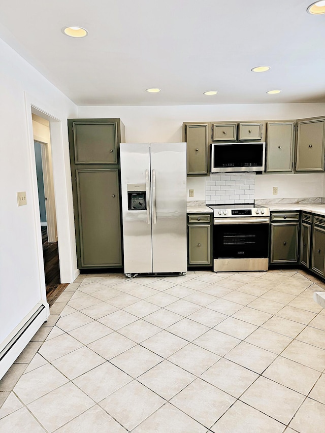 kitchen featuring a baseboard radiator, recessed lighting, appliances with stainless steel finishes, and light countertops