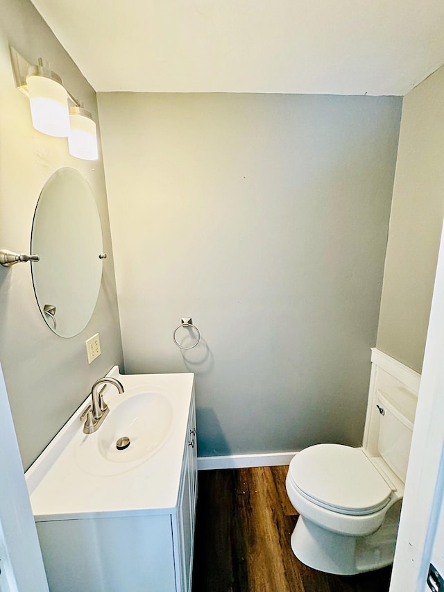 43 Stagecoach Rd, Marshfield, ME 04654 - half bath with vanity, toilet, baseboards, and wood finished floors