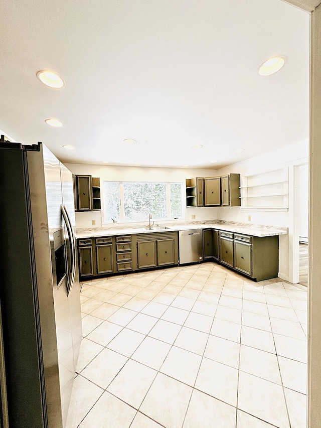 kitchen with recessed lighting, open shelves, light countertops, a sink, and appliances with stainless steel finishes