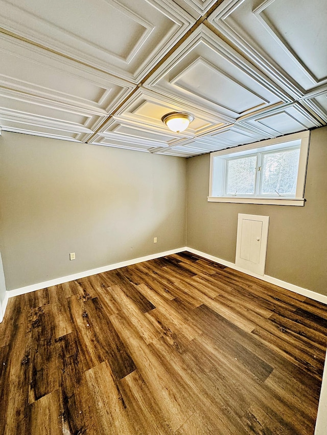 empty room with wood finished floors and baseboards