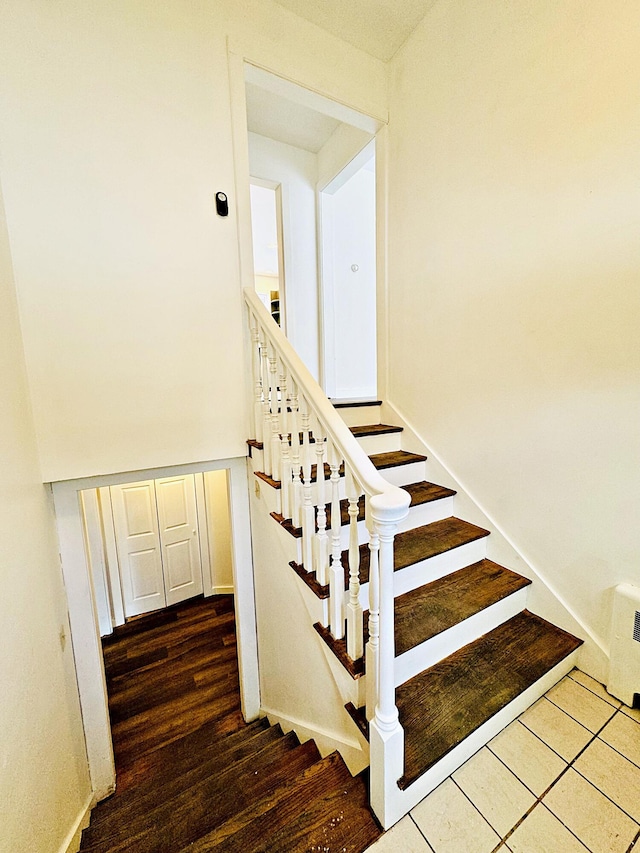 staircase featuring wood finished floors