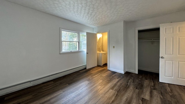 unfurnished bedroom featuring a baseboard radiator, a textured ceiling, a closet, baseboards, and dark wood-type flooring