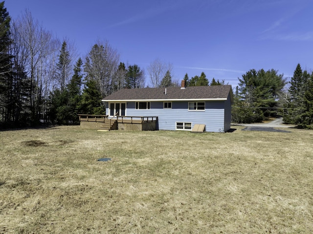 43 Stagecoach Rd, Marshfield, ME 04654 - back of house with a lawn, a chimney, and a wooden deck